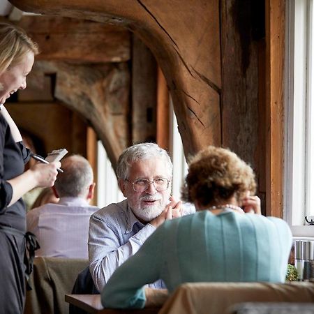 Tuddenham Mill Luxury Hotel Экстерьер фото A waitress taking an order
