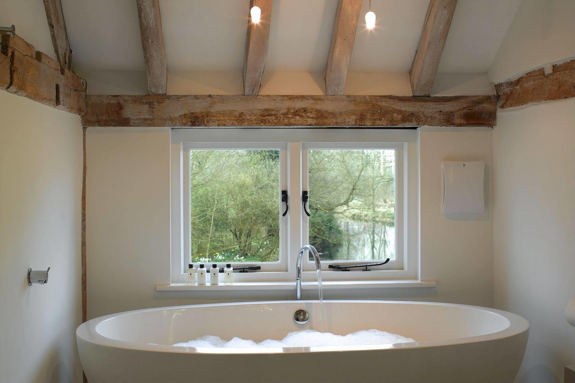 Tuddenham Mill Luxury Hotel Экстерьер фото A freestanding bathtub