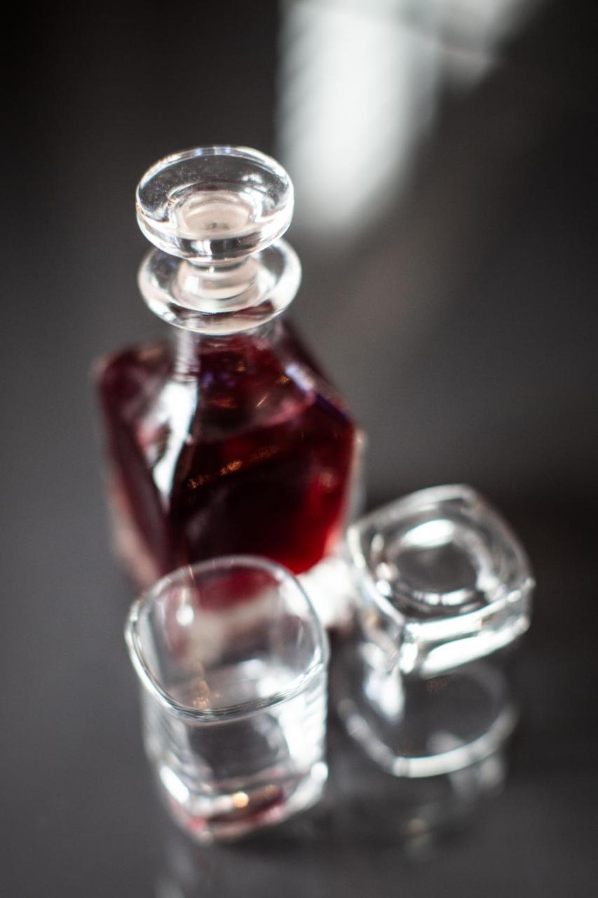 Tuddenham Mill Luxury Hotel Экстерьер фото A bottle of red wine
