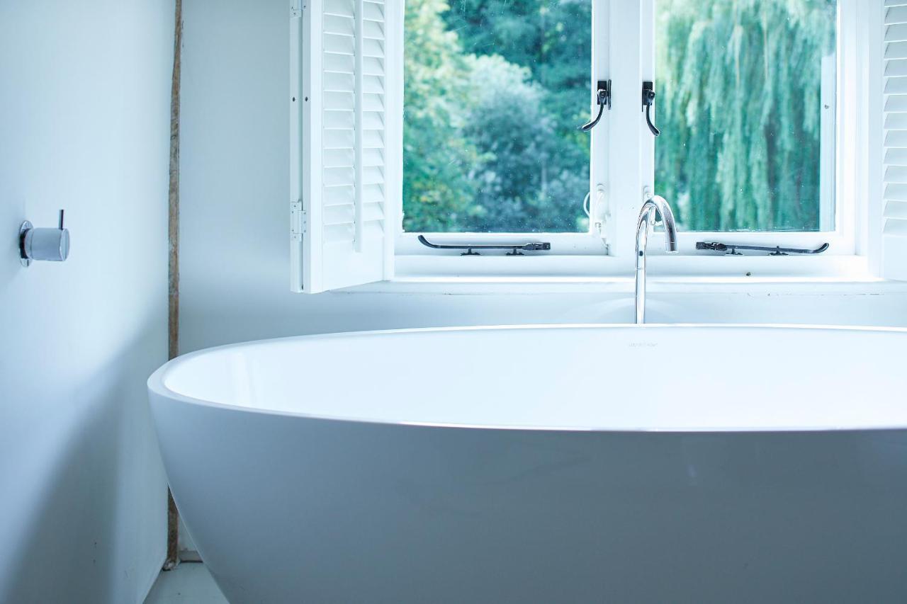 Tuddenham Mill Luxury Hotel Экстерьер фото A freestanding bathtub