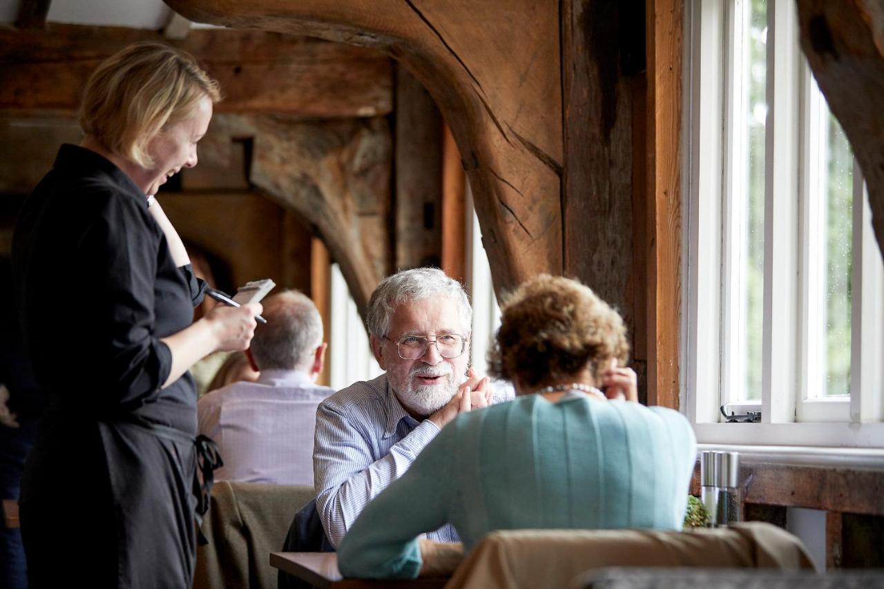 Tuddenham Mill Luxury Hotel Экстерьер фото A waitress taking an order