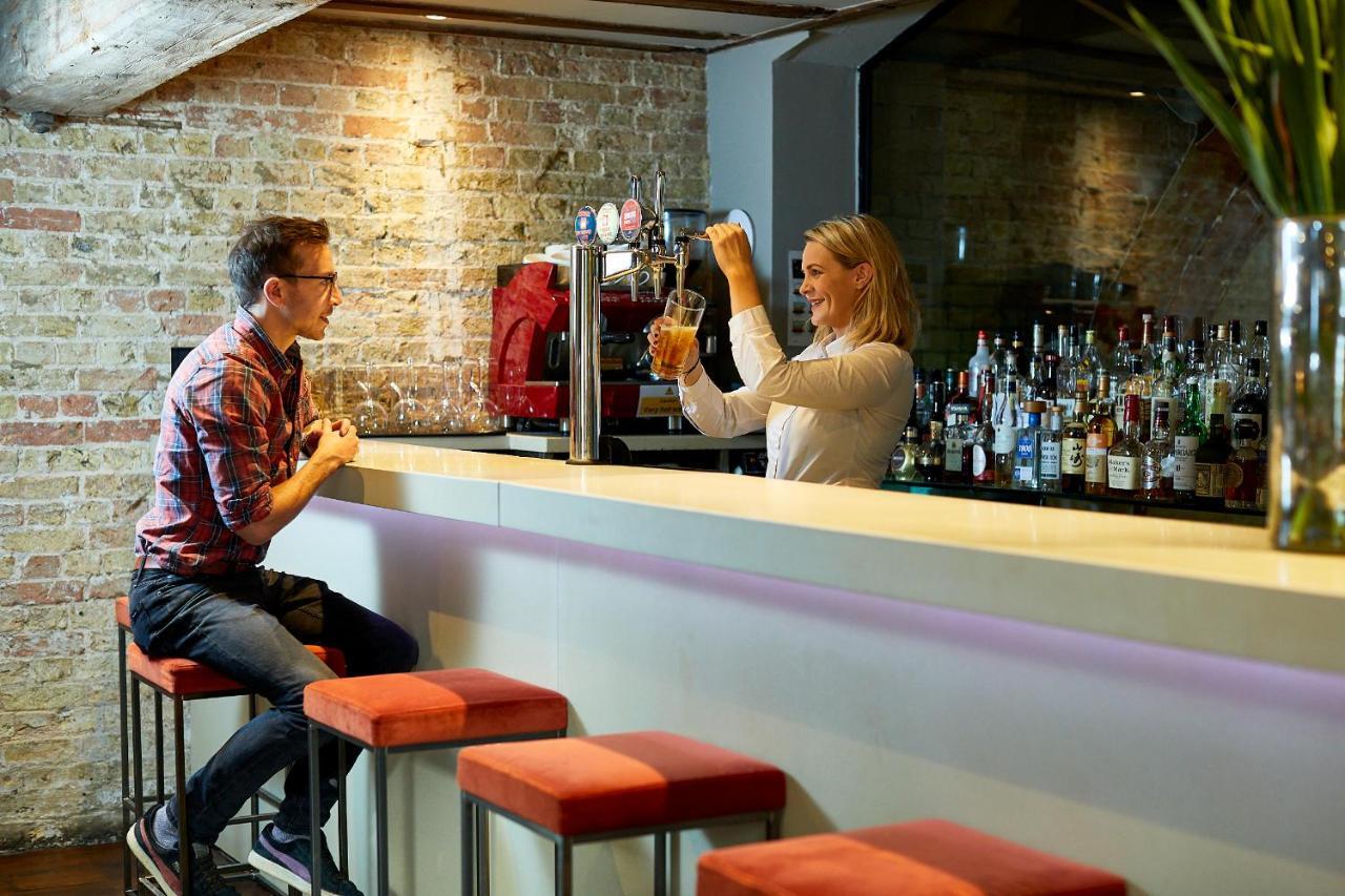 Tuddenham Mill Luxury Hotel Экстерьер фото A bartender at work