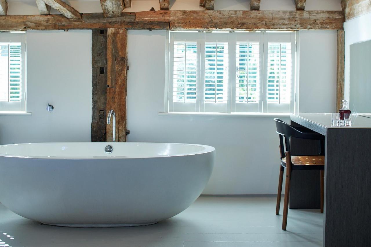 Tuddenham Mill Luxury Hotel Экстерьер фото Bathroom with shutters